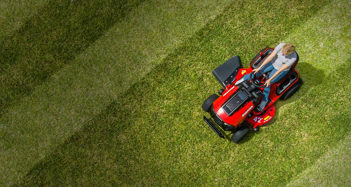 Aerial shot of person using Snapper T42 mower on lawn